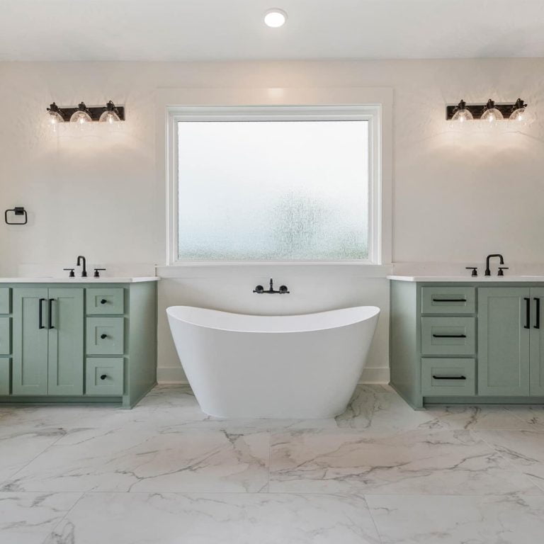 Central Arkansas Bathroom Remodel by Elite Home Design LLC - Green and white with large tub and dual vanities